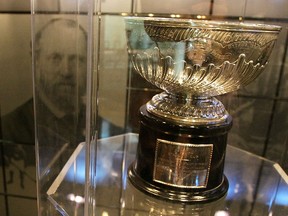 The original Stanley Cup with a photo of Lord Stanley of Preston in the background in the vault at the Great Hall at the Hockey Hall of Fame in 2009, in Toronto.