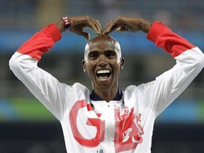 FILE - A Saturday, Aug. 20, 2016 file photo of Britain&#039;s Mo Farah gesturing on the podium as he waits to receive his gold medal for the men&#039;s 5000-meter race during athletics events at the Summer Olympics inside Olympic stadium in Rio de Janeiro, Brazil. Four-time Olympic champion Mo Farah has criticized U.S. President Donald Trump‚Äôs immigration policy, saying Sunday, Jan. 29, 2017, the temporary travel ban ‚Äúseems to have made me an alien‚Äù and leaves him unsure whether he can return to his
