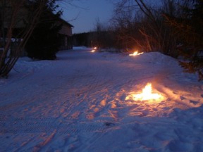 The annual event has Torchlit cross-country ski trails, bonfires, dancing to a live band, and hot chocolate with marshmallows. (Photo courtesy Skieurs de lÎle)