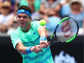Milos Raonic of Canada plays a backhand in his first-round match against Dustin Brown of Germany on day two of the 2017 Australian Open at Melbourne Park on January 17, 2017 in Melbourne, Australia.