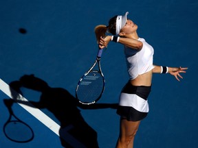 MELBOURNE, AUSTRALIA - JANUARY 18:  Eugenie Bouchard of Canada serves in her second round match against Shuai Peng of China on day three of the 2017 Australian Open at Melbourne Park on January 18, 2017 in Melbourne, Australia.