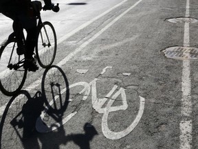 A cyclist rides in a bike lane.