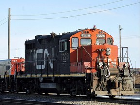 A CN locomotive goes through the CN Taschereau yard in Montreal, Saturday, Nov., 28, 2009.