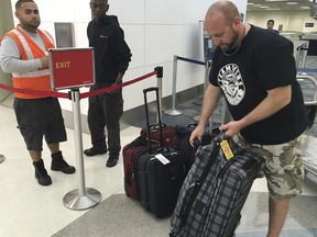 Dan Kovacs of Vancouver waits at the Fort Lauderdale-Hollywood International Airport, on Saturday, Jan. 7, 2017. In the mayhem after the shooting they lost their shoes, passports and ID's.