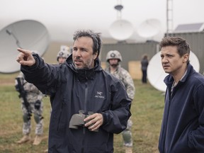 This image released by Paramount Pictures shows director Denis Villeneuve, left, and actor Jeremy Renner on the set of the film, "Arrival."  Villeneuve was nominated for an Oscar for best directing  on Tuesday, Jan. 24, 2017, for his work on the film. The 89th Academy Awards will take place on Feb. 26. (Jan Thijs/Paramount Pictures via AP) ORG XMIT: NYET210