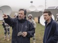 This image released by Paramount Pictures shows director Denis Villeneuve, left, and actor Jeremy Renner on the set of the film, "Arrival."