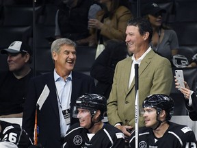 Team Lemieux coaches Bobby Orr, left, and Mario Lemieux laugh during the first period of the NHL All-Star Celebrity Shootout against Team Gretzky at Staples Center, Saturday, Jan. 28, 2017, in Los Angeles.