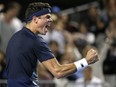 Canada's Milos Raonic celebrates after defeating France's Gilles Simon during their third round match at the Australian Open tennis championships in Melbourne, Australia, Saturday, Jan. 21, 2017.