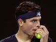 Canada's Milos Raonic grabs a ball while playing Spain's Rafael Nadal- during their quarter-final at the Australian Open tennis championships in Melbourne, Australia, Wednesday, Jan. 25, 2017. Tennis star Milos Raonic has withdrawn from Canada's Davis Cup World Group tie against Britain after a nagging adductor injury flared up during his recent Australian Open run.