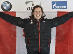 Canadian skeleton athlete Elisabeth Vathje celebrates her first place after the first Women's Singles run during the Skeleton World Cup in Winterberg, Germany, Sunday Jan. 15, 2017.