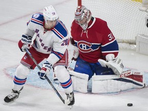 New York Rangers' Chris Kreider (20) moves in on Montreal Canadiens goaltender Carey Price during first period NHL hockey action in Montreal, Saturday, January 14, 2017.