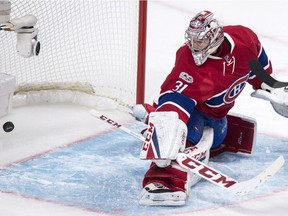 Montreal Canadiens goalie Carey Price looks back at the puck in the net on a goal by Pittsburgh Penguins' Eric Fehr during second period NHL hockey action Wednesday, January 18, 2017 in Montreal.