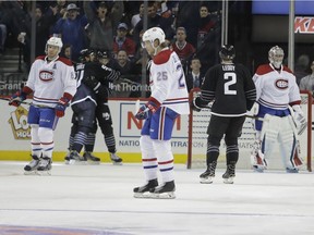 Canadiens' Jacob De La Rose, right, Shea Weber and goalie goalie Carey Price react as Islanders' John Tavares and Andrew Ladd celebrate Ladd's goal in the third period Thursday night.