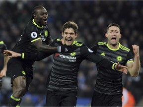 Chelsea's Marcos Alonso, centre, celebrates scoring his second goal during the English Premier League soccer match between Leicester City and Chelsea at the King Power Stadium in Leicester, England, Saturday, Jan. 14, 2017.