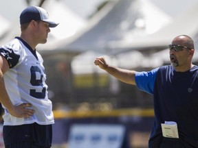 Dallas Cowboys special-teams coach Rich Bisaccia, right, talks to long snapper Louis-Philippe Ladouceur during a morning practice at NFL football training camp, Wednesday, July 30, 2014, in Oxnard, Calif. Ladouceur is the Dallas Cowboys' best-kept secret. For 12 years, the Montreal long snapper has avoided the spotlight playing in one of pro football's most high-profile markets.