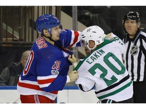 NEW YORK, NY - JANUARY 17: Chris Kreider #20 of the New York Rangers fights with Cody Eakin #20 of the Dallas Stars during the second period at Madison Square Garden on January 17, 2017 in New York City.