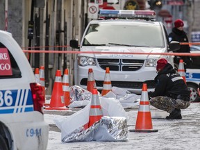 Montreal police investigators at the scene were a man was stabbed on St-Paul street near the corner of Chagouamignon street in the Old Port of Montreal on Friday, January 13, 2017.