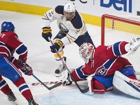 Buffalo Sabres' Evander Kane (9) moves in on Montreal Canadiens goaltender Carey Price as Canadiens' Max Pacioretty defends during first period NHL hockey action in Montreal, Saturday, January 21, 2017.