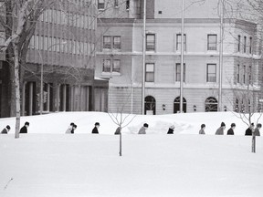 Commuters in the snow, near the Windsor Hotel (1969). From historian Jean-François Nadeau's book Montrealers: A Story in Portraits.