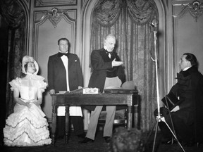 French actress Madeleine Renaud, actors Sacha Guitry, Denis d'Inès and Louis Jouvet on stage in a Paris theatre, 1939.