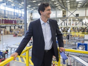 Jean Coutu president and CEO François Jean Coutu takes a look around the company's distribution centre in Varennes, Que., in July 2016.