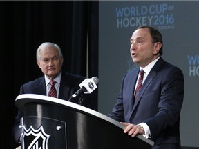 In this Jan. 24, 2015 file photo, NHL commissioner Gary Bettman, right, and NHL Player's Association executive director Donald Fehr take part in announcing the return of the World Cup of Hockey in 2016 in Toronto, during a news conference at Nationwide Arena in Columbus, Ohio.