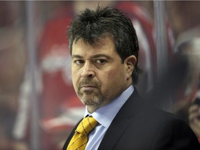 In this April 5, 2016, file photo, New York Islanders head coach Jack Capuano stands in the bench during the second period of an NHL hockey game against the Washington Capitals in Washington.