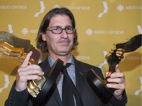 Jean-René Dufort holds up his trophy for his role in the television show Infoman at the annual Gala Gemeaux awards ceremony in Montreal, Sunday, September 20, 2015. The Infoman 2016 end of year satire drew 1.7 million viewers on New Year’s Eve.