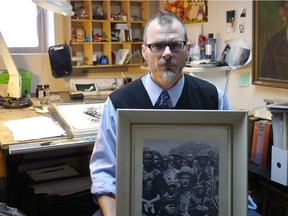 Joe Ollmann holds a photo of William Seabrook in the Ivory Coast town of Grand-Bassam in 1929. "I liked his writing and felt bad it was all out of print and forgotten," Ollmann says. "But even more, I felt like: 'Why does no one know about this guy’s crazy, fantastic life?' ”