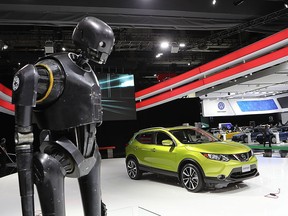 K2S0, a droid from Star Wars Rogue One, with Nissan's Qashqai at the Montreal International Auto Show.