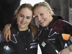 Kaillie Humphries, right, and Melissa Lothholz from Canada, celebrate their victory after winning the women's bob World Cup competition in Altenberg, Germany, on Friday, Jan. 6, 2017.