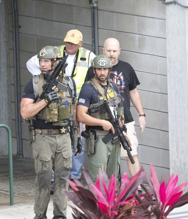 Law enforcement personnel are shown outside a garage area at Fort Lauderdale–Hollywood International Airport, Friday, Jan. 6, 2017, in Fort Lauderdale, Fla., after a shooter opened fire inside a terminal of the airport, killing several people and wounding others before being taken into custody.