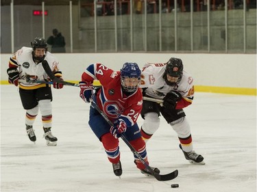 Les Canadiennes forward Ann-Sophie Bettez (No. 24) controls the puck during a Canadian Women's Hockey League game against the Calgary Inferno at the Civic Centre in Dollard-des-Ormeaux, Jan. 15, 2017.