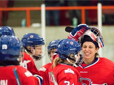 Les Canadiennes players are all smiles after winning against the Calgary Inferno at the Civic Centre in Dollard-des-Ormeaux, Jan. 15, 2017. Les Canadiennes are currently in second place, two points behind the Calgary Inferno. Photo credit: Céline Gélinas/CWHL