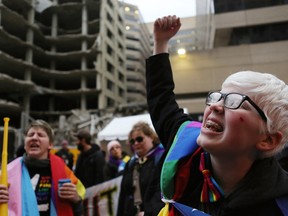 LGBT supporters chant during an anti-Trump demonstration on January 20, 2017, in Washington, D.C. President-elect Donald Trump will be sworn in as the 45th U.S. President later today.