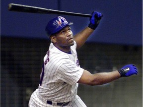 Montreal Expos outfielder Tim Raines bats against the New York Mets during the home opener at Olympic Stadium on April 4, 2001.