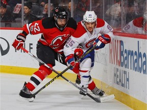 Kyle Quincey of the New Jersey Devils checks Andrew Shaw of the Montreal Canadiens during the first period at the Prudential Center on Friday, Jan. 20, 2017, in Newark.