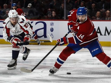 Montreal Canadiens centre Tomas Plekanec (14) is checked by Washington Capitals centre Liam O'Brien (87) during 1st period NHL action at the Bell Centre in Montreal, on Monday, January 9, 2017.