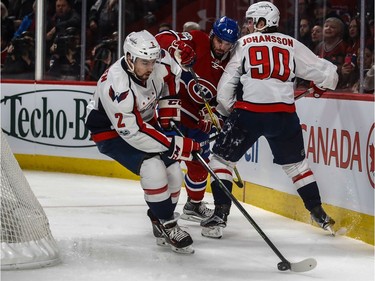 Washington Capitals defenceman Matt Niskanen (2) clears the puck from behind the net while Washington Capitals left wing Marcus Johansson (90) impedes Montreal Canadiens right wing Alexander Radulov (47) during 1st period NHL action at the Bell Centre in Montreal, on Monday, January 9, 2017.