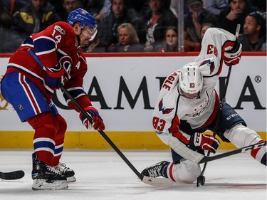 Montreal Canadiens centre Tomas Plekanec (14) can't get the puck from Washington Capitals centre Jay Beagle (83) during 3rd period NHL action at the Bell Centre in Montreal, on Monday, January 9, 2017.