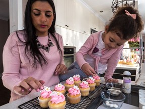 Shirley Bensimon, at home in Pointe-Claire with her daughter, Mikaela, on Wednesday, January 11, 2017, is a mechanical engineer at Bombardier Aerospace working on the Global 7000 business aircraft, and has a growing side business as a home baker. On Jan. 5, she took first place in a worldwide online competition for the title of 2016's Most Trusted Cake Decorator on the website AmazingCakeIdeas.com.
