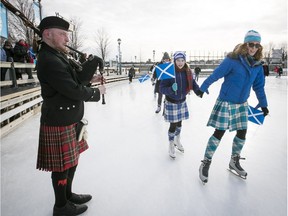 Bagpiper Olivier Rommelaere performs on the ice rink in the Old Port on Saturday, Jan. 14, 2017, as kilt wearing skaters Rebecca Matulina and her mother, Maureen Leaman, skate by during the Great Canadian Kilt Skate in Montreal. The event marks the 375th anniversary of Montreal, 150th anniversary of Confederation and 202nd birthday of Sir John A. Macdonald.