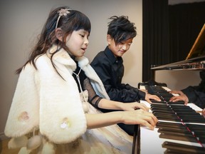 Piano prodigies Clari Ma and Leo Wang play together at the Lambda School of Music and Fine Arts in Pierrefonds-Roxboro, Saturday January 14, 2017.