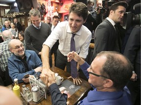 Prime Minister Justin Trudeau greets restaurant patrons in Montreal on Jan. 18.