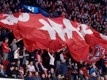 Canadiens fans pass a Go Habs Go flag around the Bell Centre during NHL action between the Canadiens and the Pittsburgh Penguins at the Bell Centre in Montreal on Wednesday January 18, 2017.