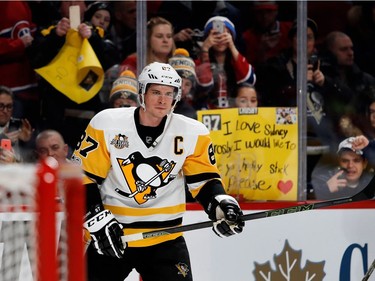 Fans hold signs for Pittsburgh Penguins centre Sidney Crosby as he takes part in the pre-game skate during NHL action against the Montreal Canadiens at the Bell Centre in Montreal on Wednesday January 18, 2017.