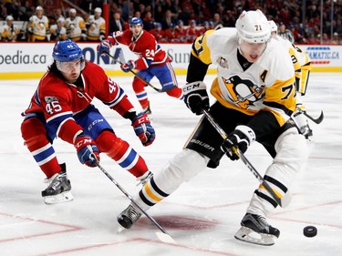 Montreal Canadiens defenceman Mark Barberio knocks the puck from Pittsburgh Penguins centre Evgeni Malkin during NHL action at the Bell Centre in Montreal on Wednesday January 18, 2017.