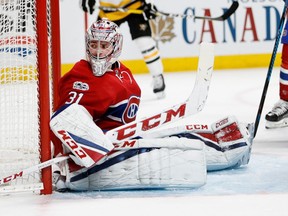 Montreal Canadiens goalie Carey Price falls back in to his net after making a save against the Pittsburgh Penguins during NHL action at the Bell Centre in Montreal on Wednesday January 18, 2017.