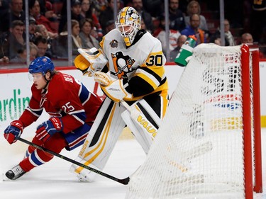 Montreal Canadiens left wing Jacob De La Rose ducks around Pittsburgh Penguins goalie Matt Murray as Murray tries to play the puck from behind the net during NHL action at the Bell Centre in Montreal on Wednesday January 18, 2017.