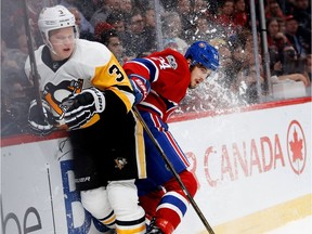 Canadiens centre Phillip Danault looks back at the play after hitting Penguins defenceman Olli Maatta during action at the Bell Centre on Wednesday, Jan. 18, 2017.